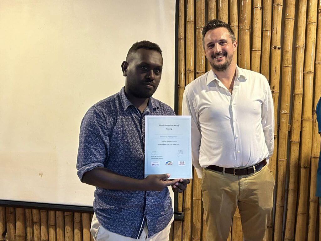 Solomon Star Lachlan Eddie with his certificate